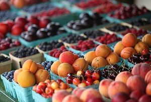 Farmers market display with various kinds of fruit