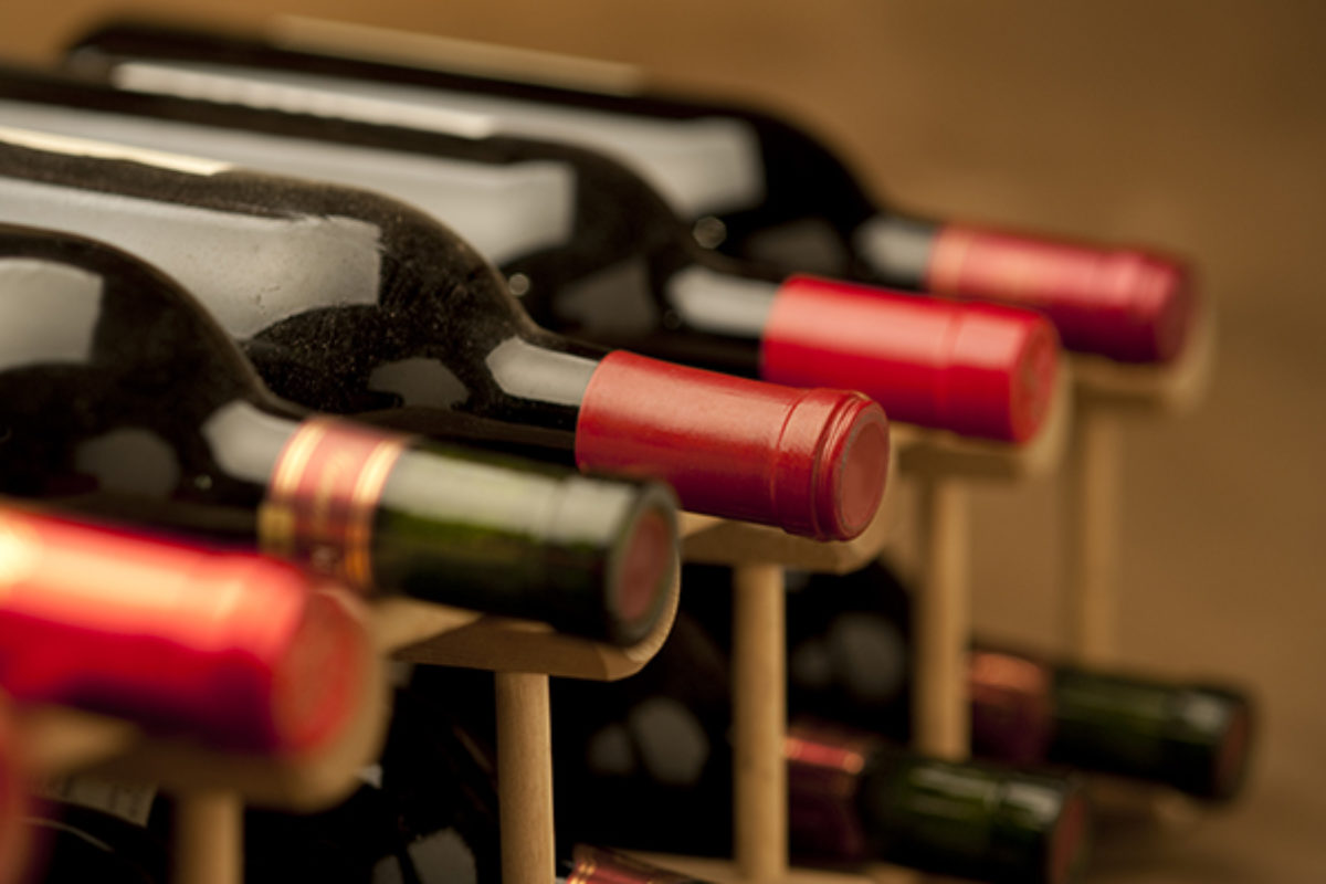 Red wine bottles on a wine rack