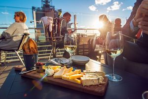 Restaurant serving a cheese tray and wine